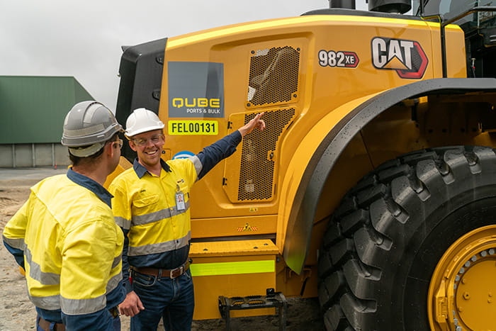The Qube Team Looking at Cat XE Wheel Loader