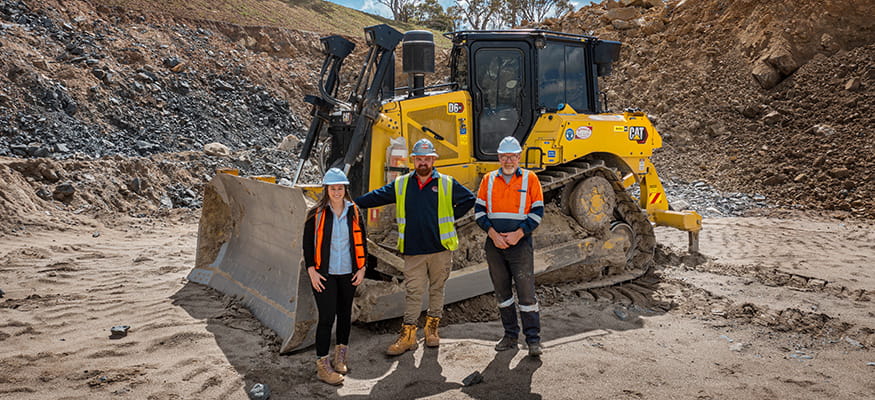 Divalls Team in front of Cat XE Dozer