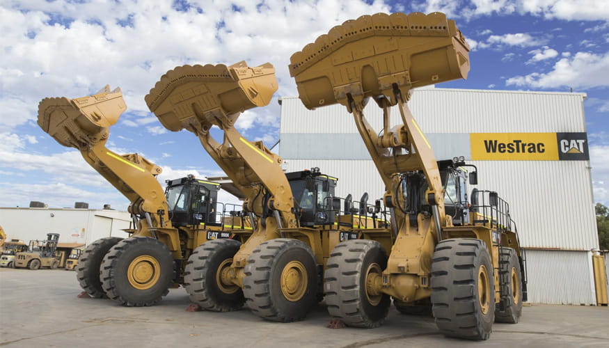 Three Cat 990k wheel loaders