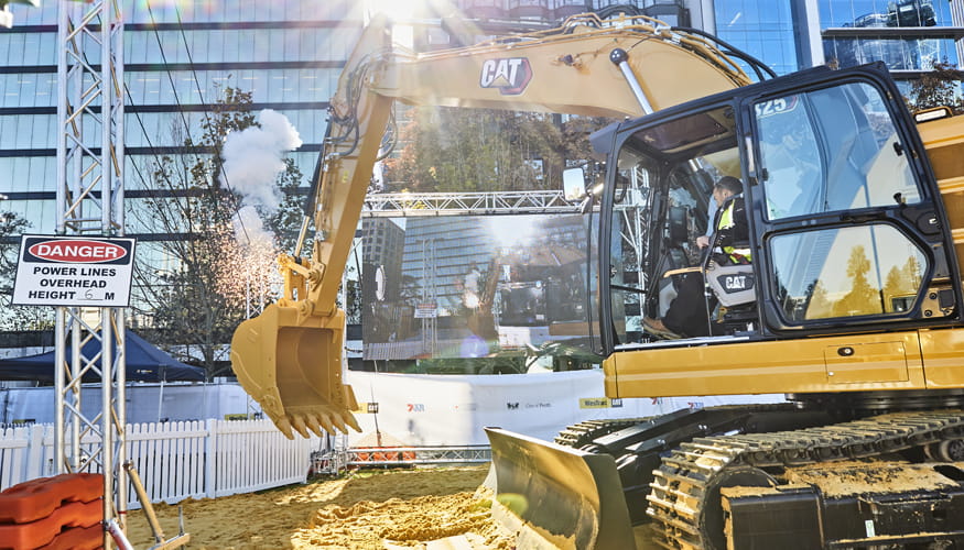 A Cat excavator in action at the WesTrac and Caterpillar display in Elizabeth Quay