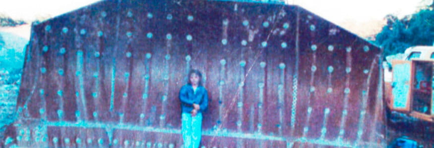 Asha Russell standing in front of a dozer