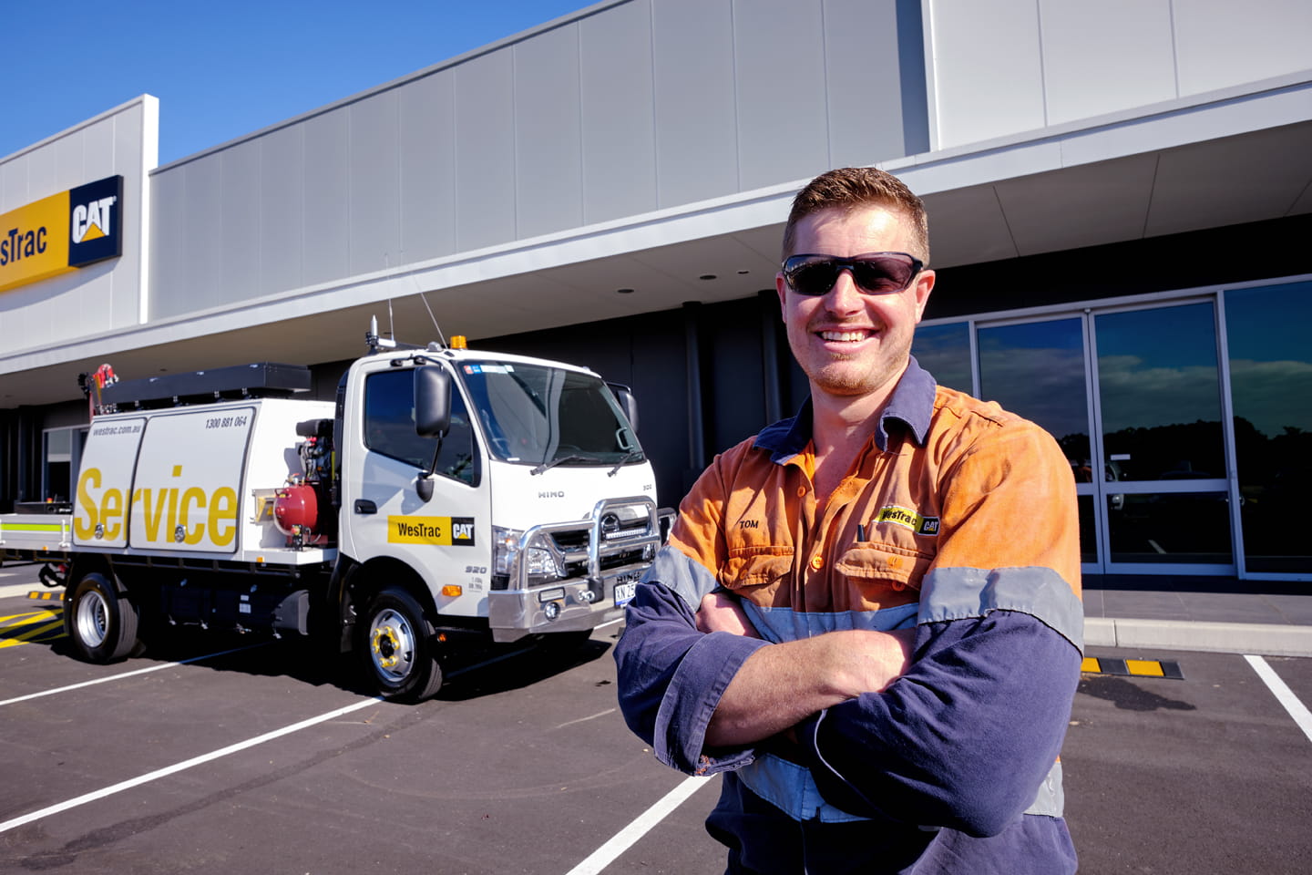 Field service technician in front of service truck and Marsden Park branch
