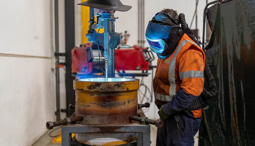 WesTrac Team Member using rotary welding equipment