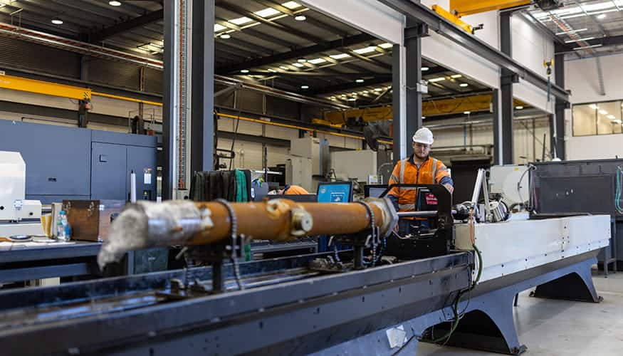 WesTrac Team Member using a hone