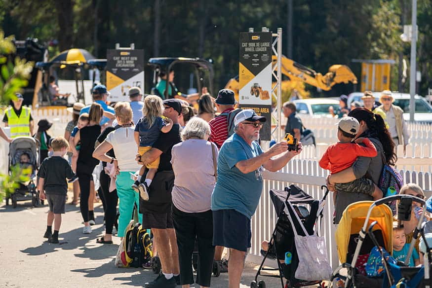 Line up for a go on a mini digger