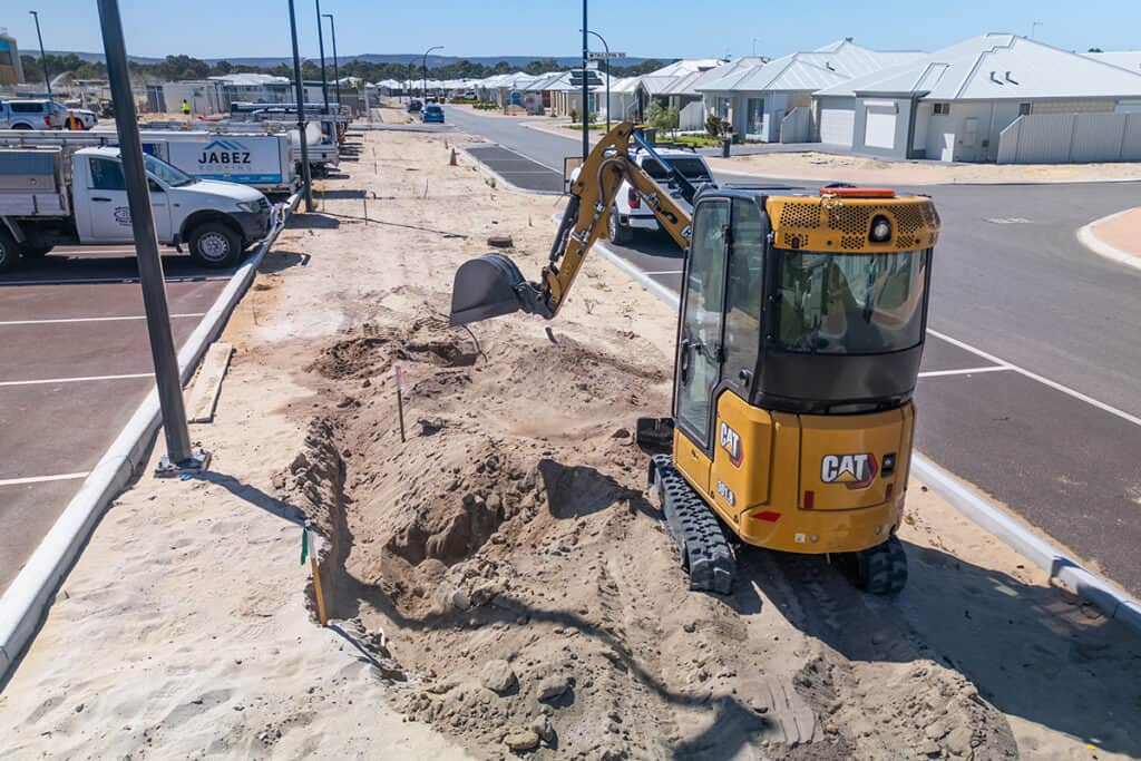 PGC Irrigation Contractors new Cat Mini Excavator working on a city job