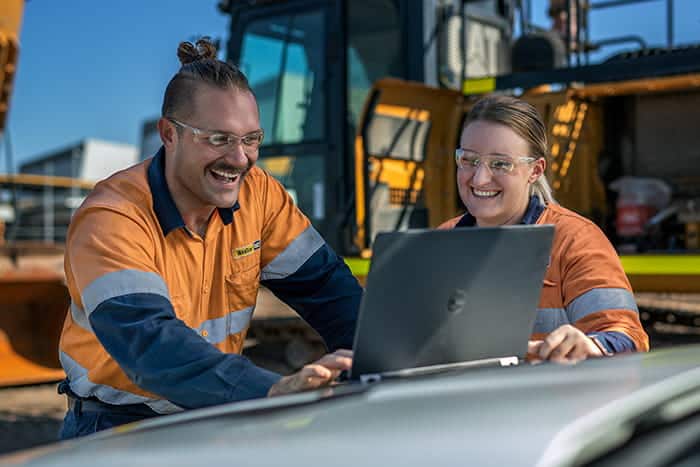 Two team members working together