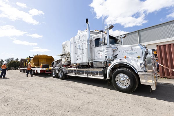 Loading machine onto trailer