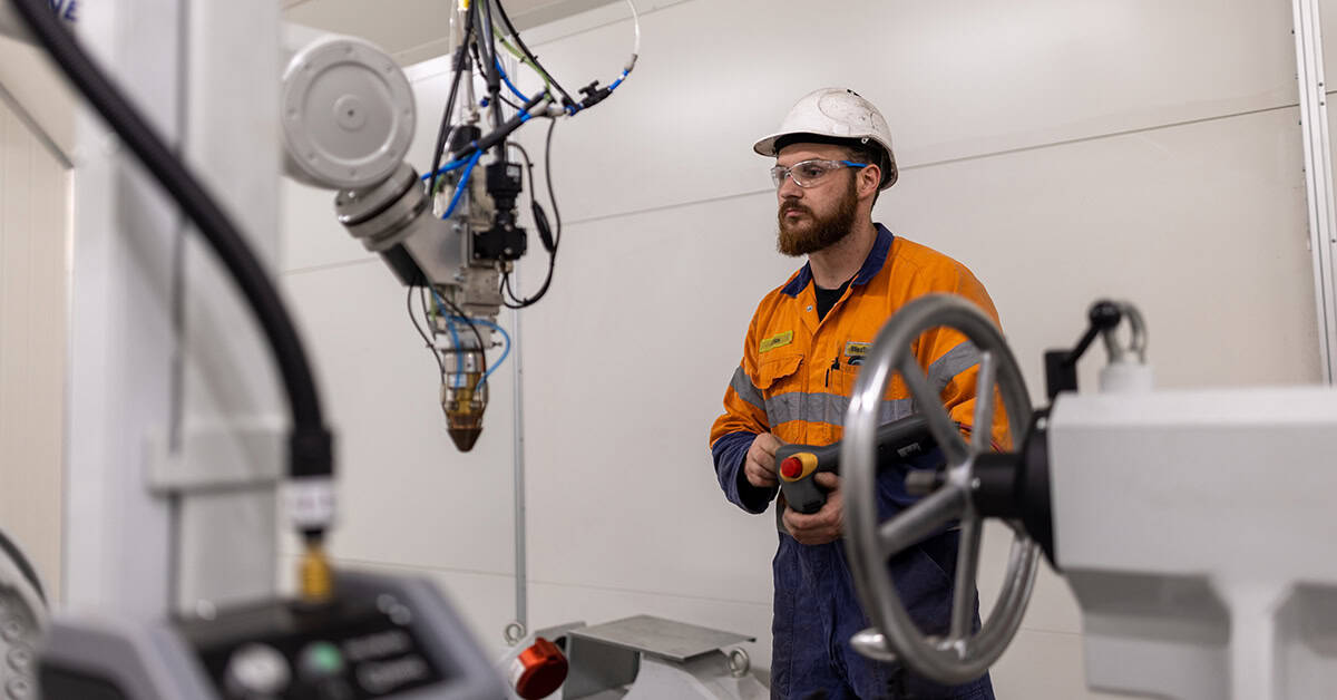 WesTrac team member inside the Hornet machine in the machining workshop