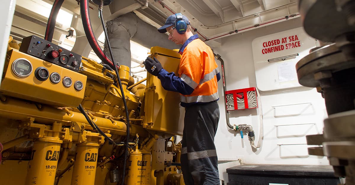 WesTrac team member repairing a marine engine