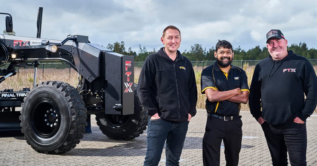 WesTrac rep Buddhi standing with the team from FTX at WesTrac Newcastle