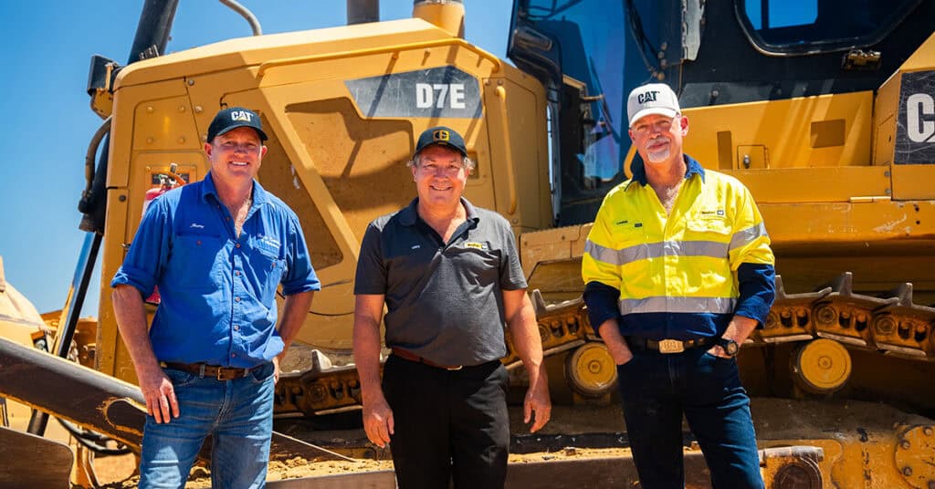 Thurkles and WesTrac reps standing in front of their repaired undercarriage