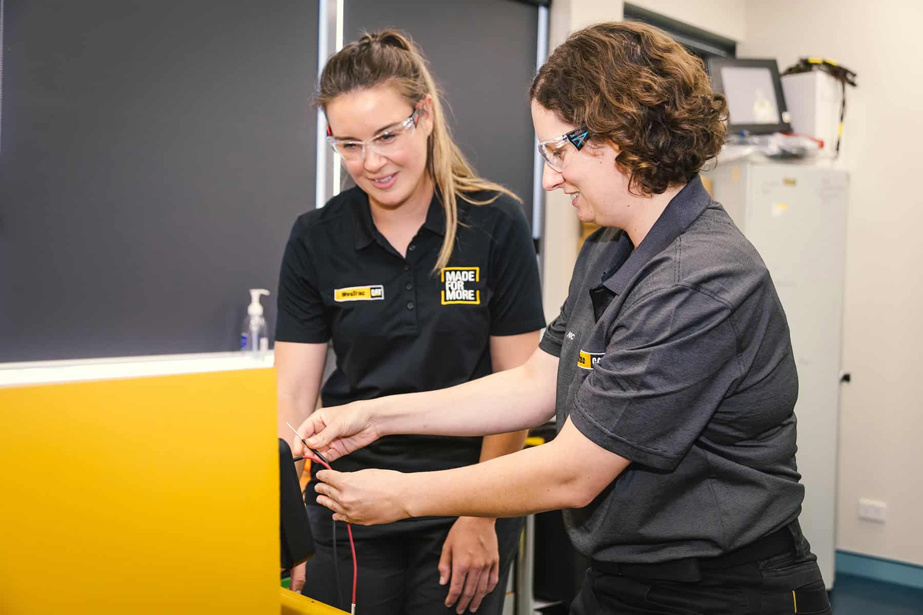 Two females learning in a classroom