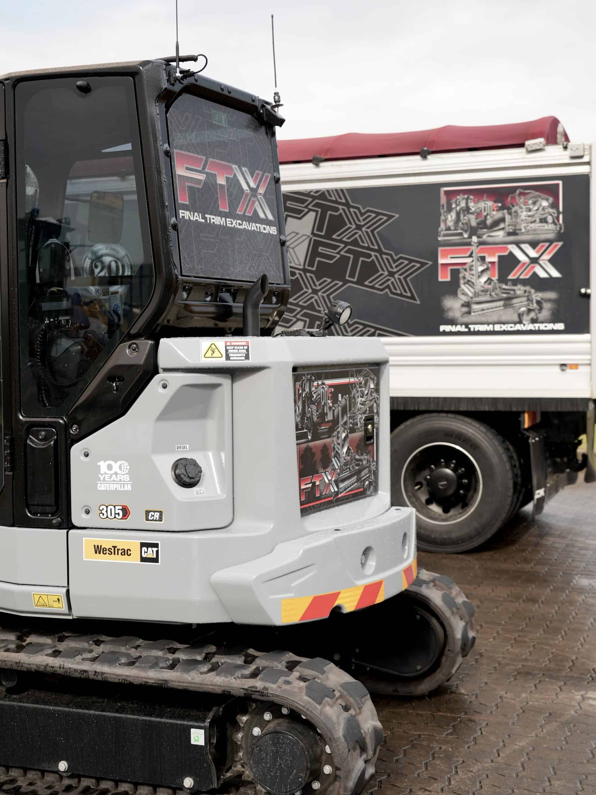 Back of the FTX Centennial Grey Cat Mini Excavator